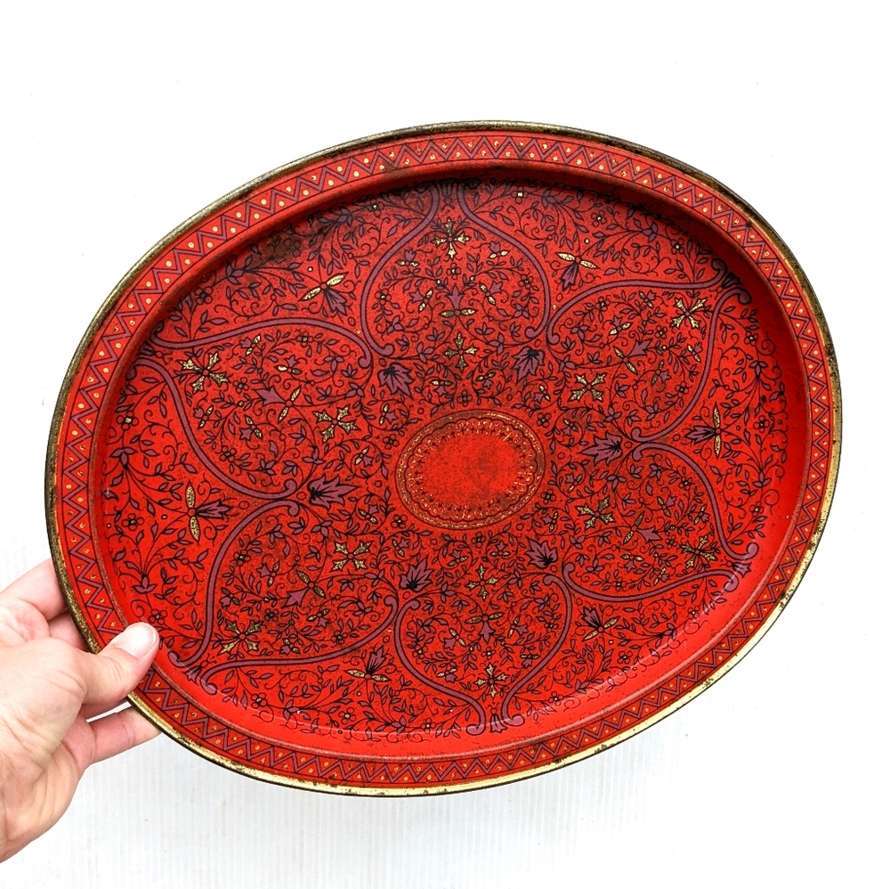 VINTAGE red swirl printed oval collectors decorative tin plate